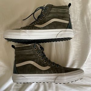 Sherpa lined High Top Suede Vans in dark green